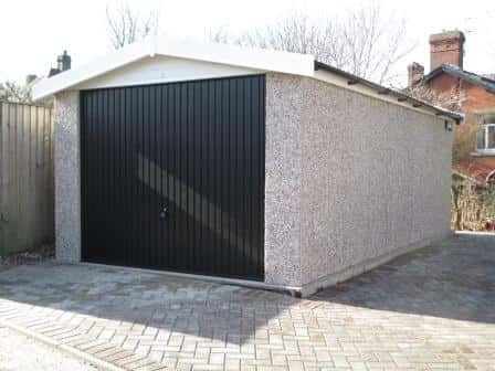 Concrete garages with an apex roof are shaped like the capital letter A