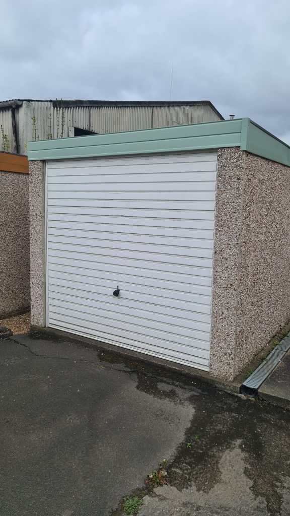 Pent roof garage with Chartwell green UPVC fascias